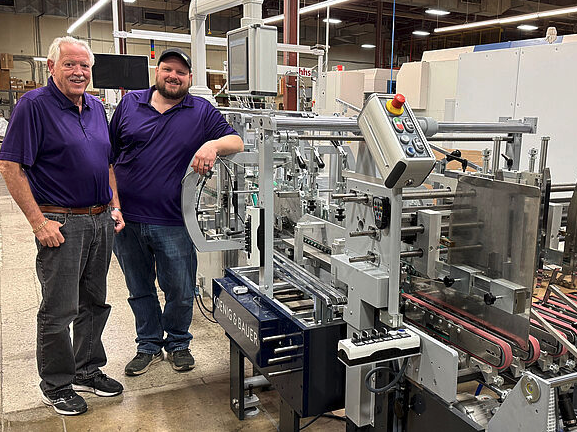 L to R: Jerry Theoret, Battlefield&rsquo;s CEO; and Matt Theoret, Battlefield&rsquo;s vice president of manufacturing and  Allpro 110 folder gluer. 