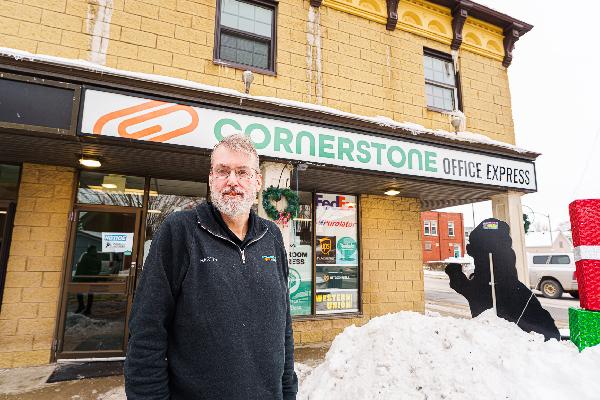 Martyn Vos owner of Cornerstone Office Express in front of the location in Acton, Ontario  