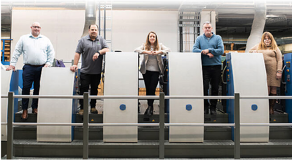president Sarah Skinner (center) and her team